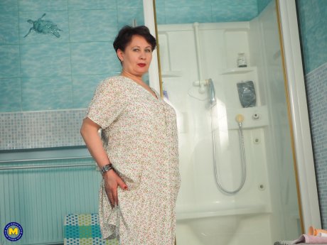 Modern Grandma Nata loves to play with her dildo and her pussy in the bathroom